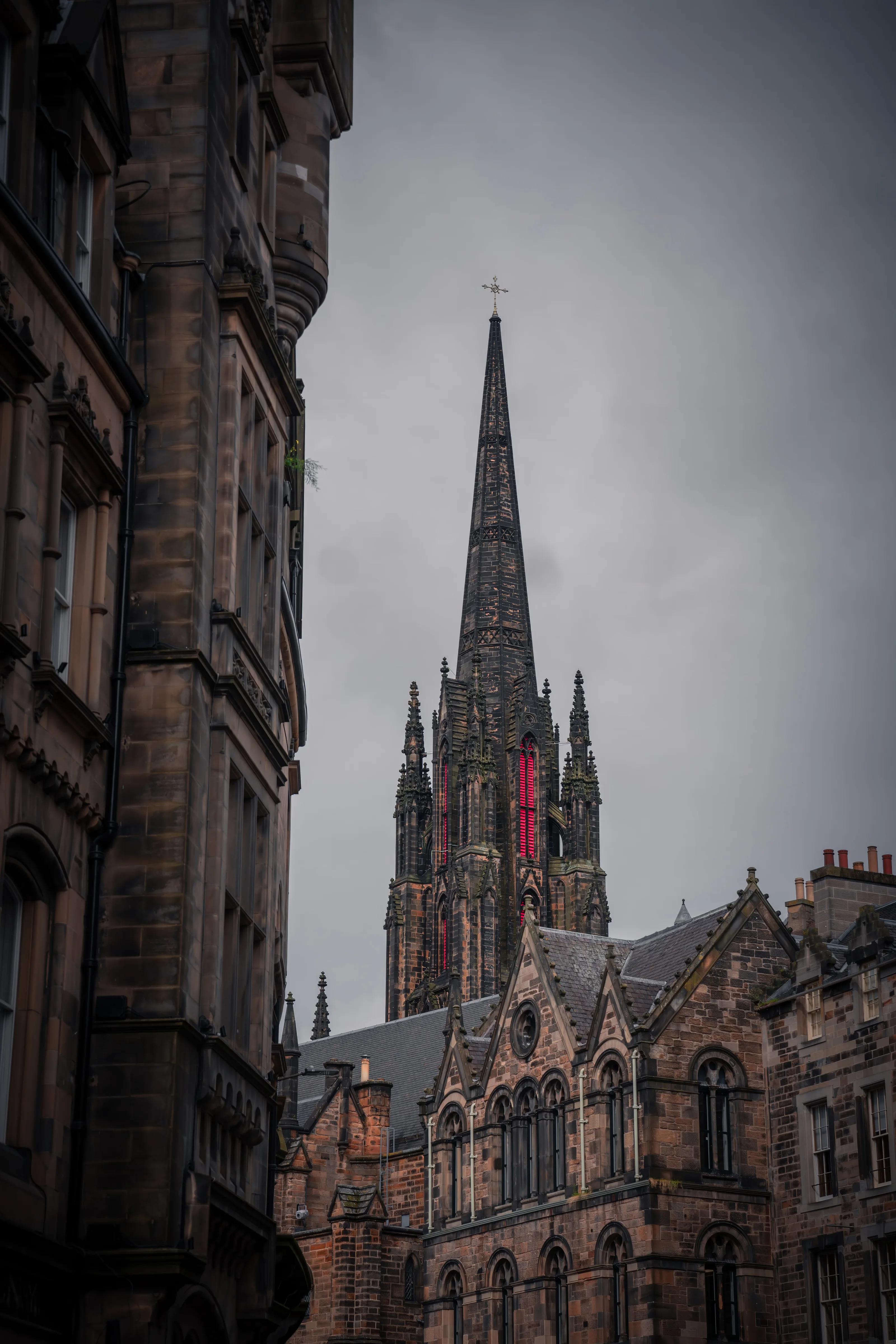 Edinburgh's gothic spires against a moody Scottish sky — stone, shadow, and centuries of history pressed into a single frame.